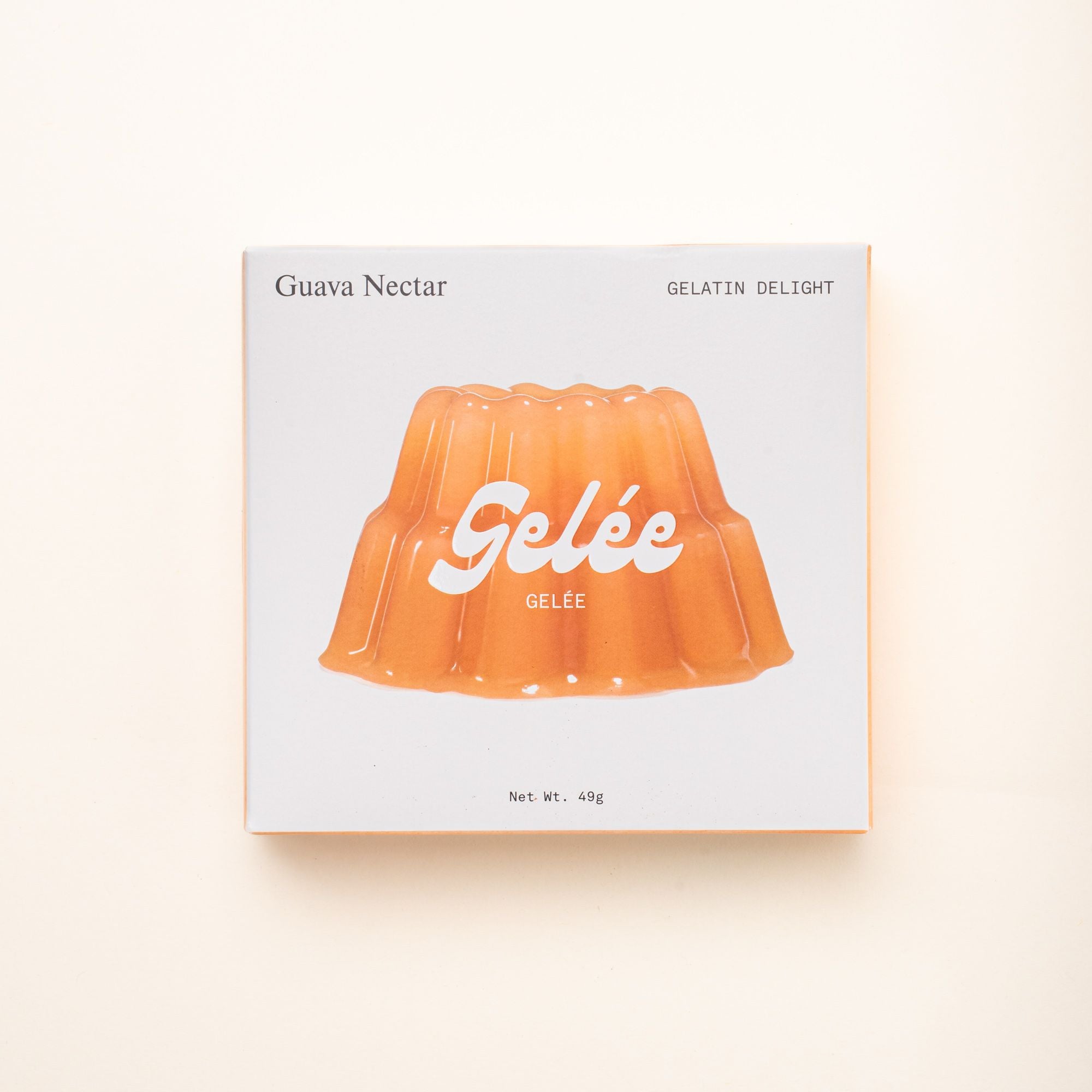 A box of Gelée Guava Nectar Gelatin Delight, featuring an image of an orange gelatin mold on a minimalist white package.