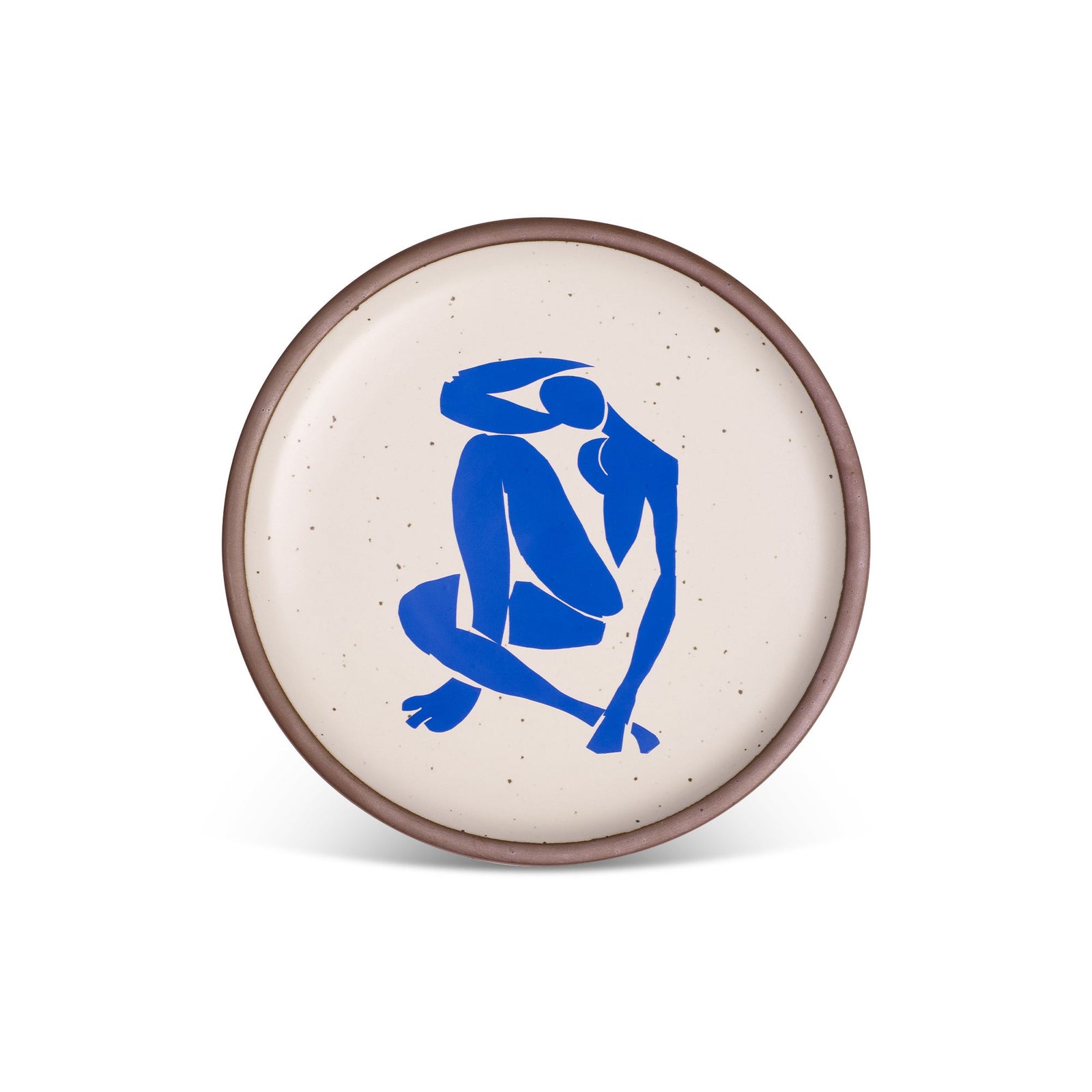 A round plate with a speckled cream background featuring a bold blue abstract figure in a sitting pose, bordered by a thin, earthy rim.