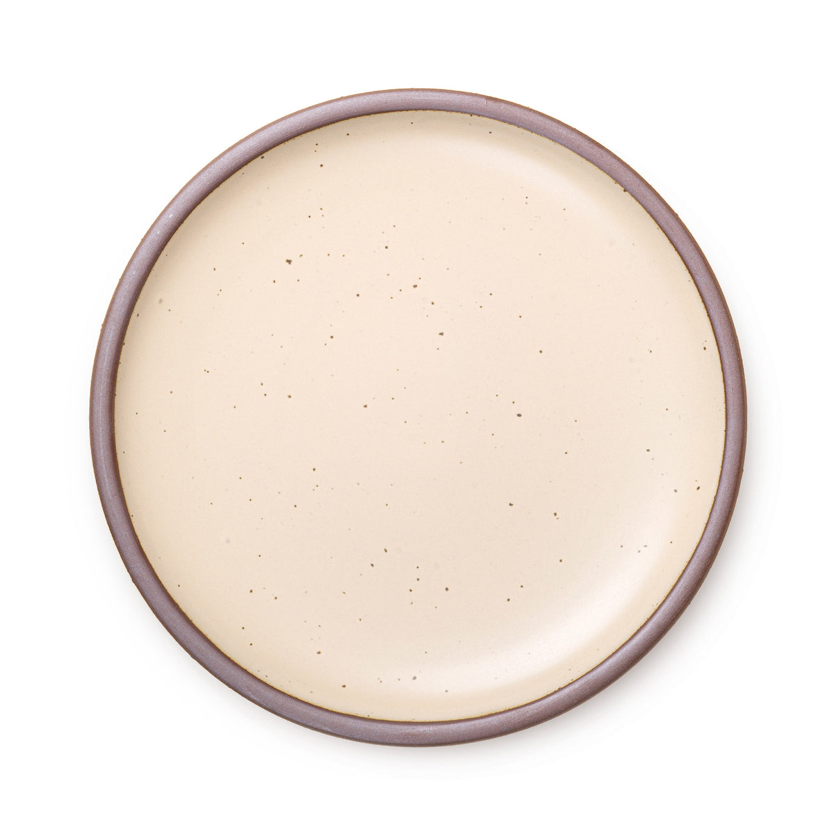 A large ceramic platter in a crean color featuring iron speckles and an unglazed rim.