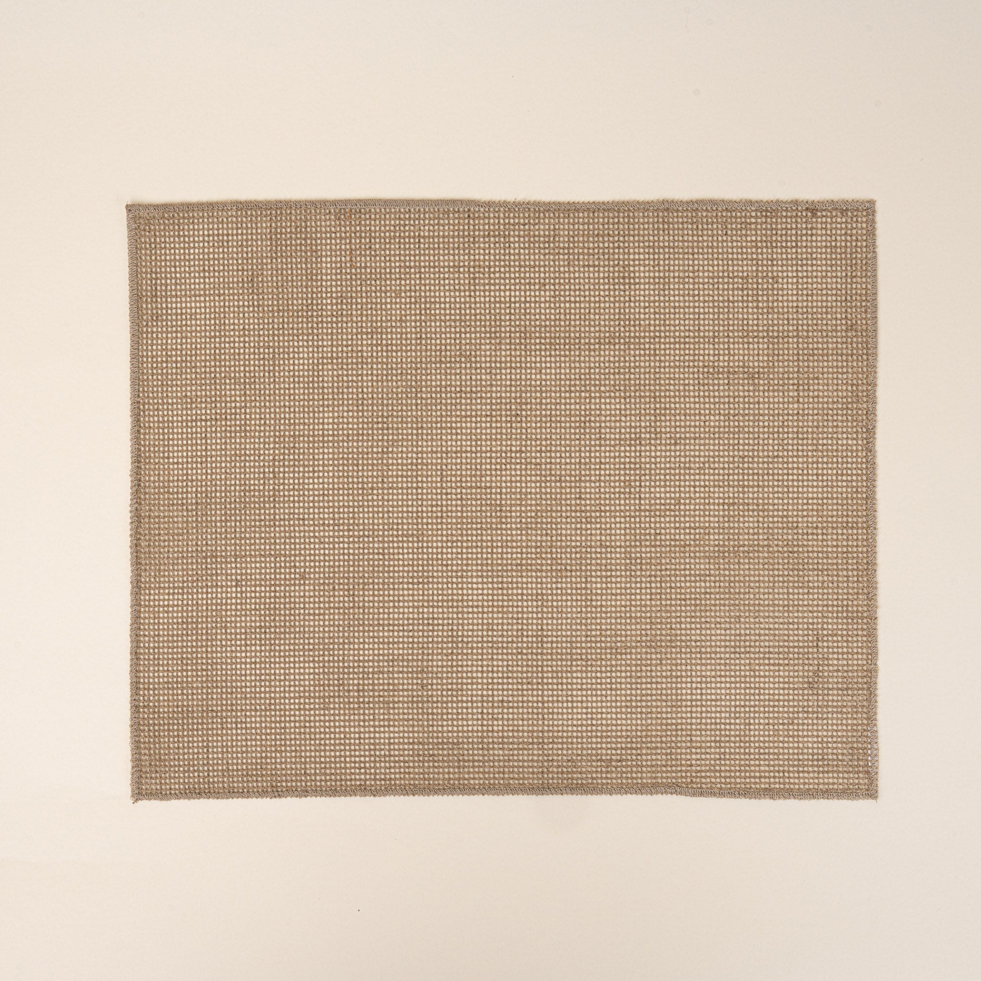 Textured woven placemat in a natural neutral color