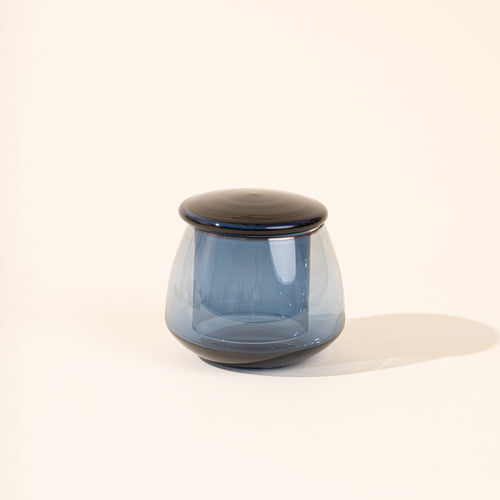 Blue clear glass butter keeper on white background