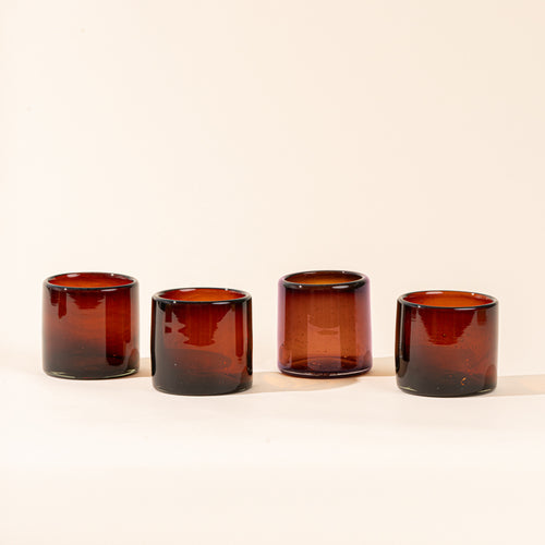 4 dark amber short transparent drinking glasses