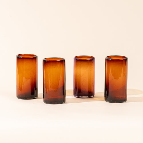 4 dark amber tall transparent drinking glasses