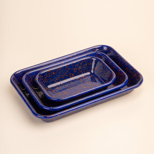 3 nesting trio rectangular baking dishes in a midnight blue color with red splattered pattern