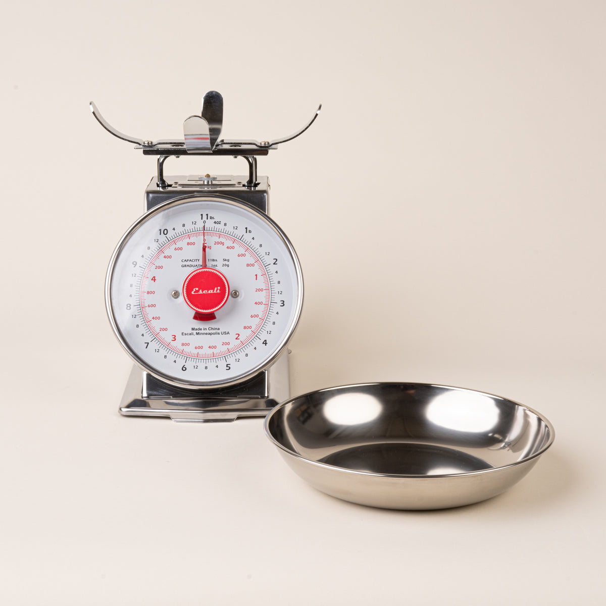 Stainless steel vintage kitchen scale, with the bowl set aside on the right.