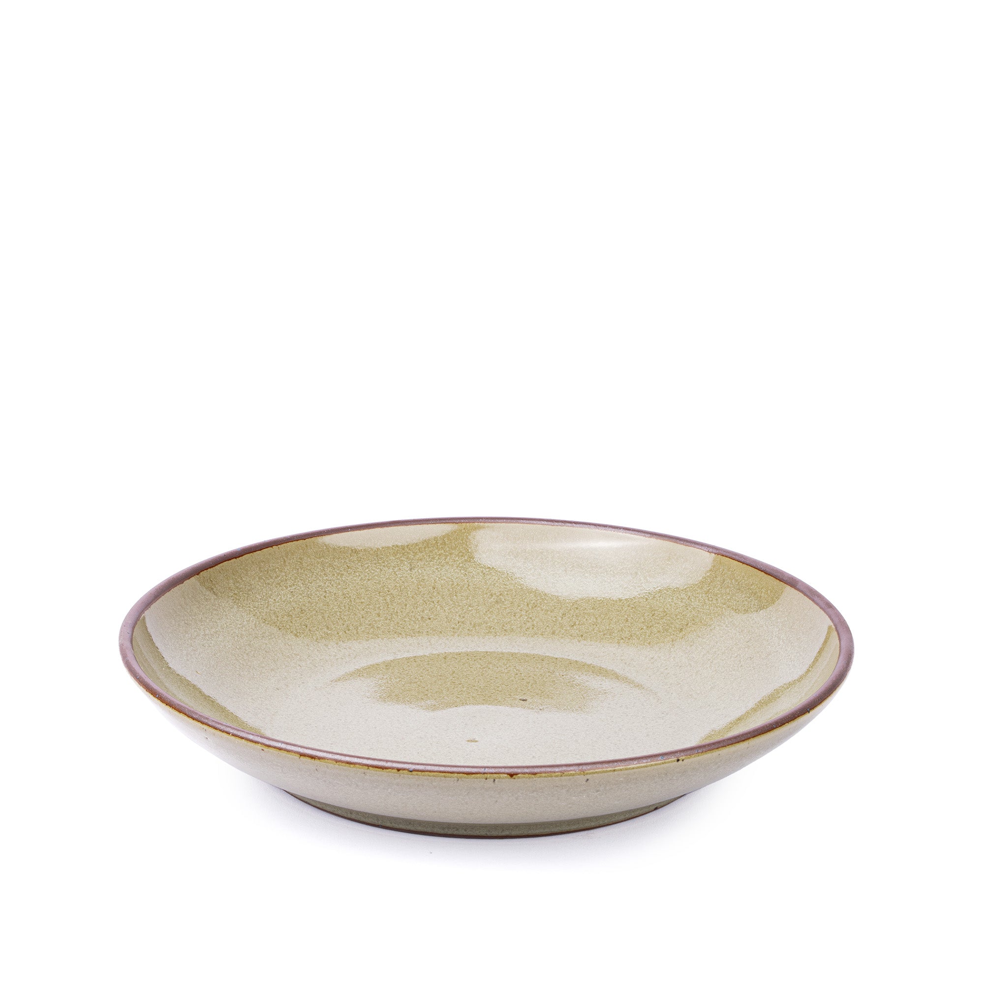 A large ceramic plate with a curved bowl edge in a reflective dappled grey-green color and an unglazed rim.