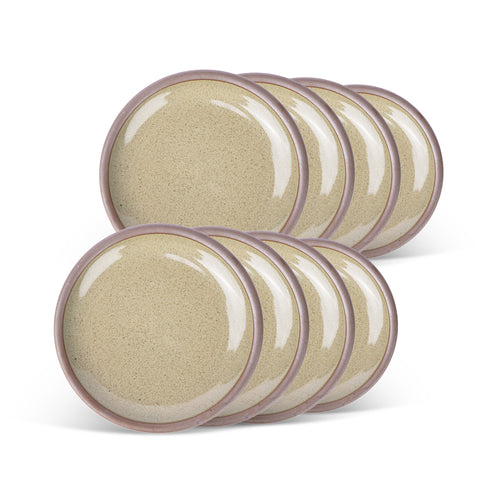 A stack of 8 dessert sized ceramic plates in a reflective dappled grey-green color featuring an unglazed rim.