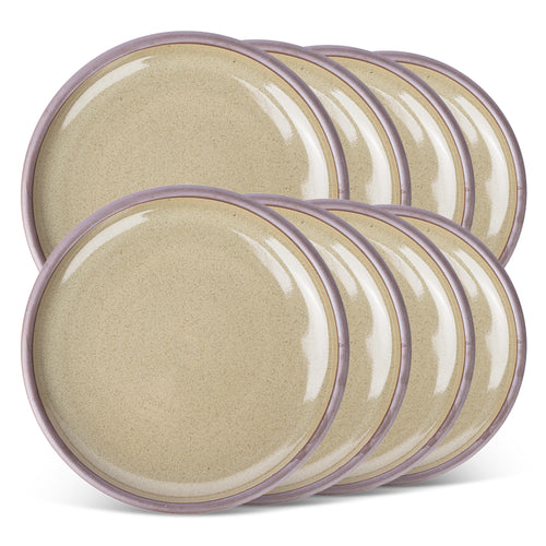 A stack of 8 dinner sized ceramic plates in a reflective dappled grey-green color featuring an unglazed rim