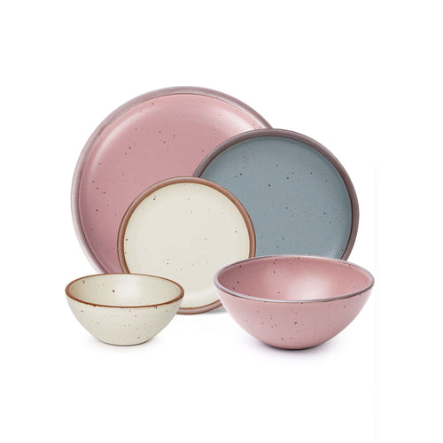 A a soup bowl and dinner plate in a dusty mauve pink, a side plate in blue-grey, and a cake plate and ice cream bowl in a warm off-white color.