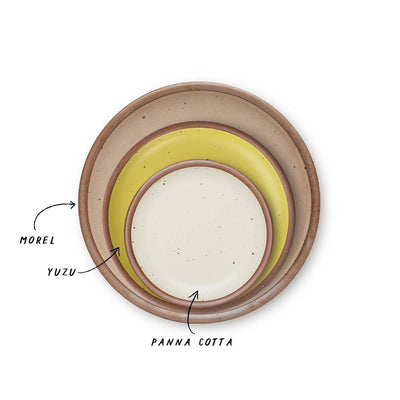 A stack of 3 plates in Dinner, Side, and Cake sizes in a warm pale brown, zesty yellow colors, and warm off-white.