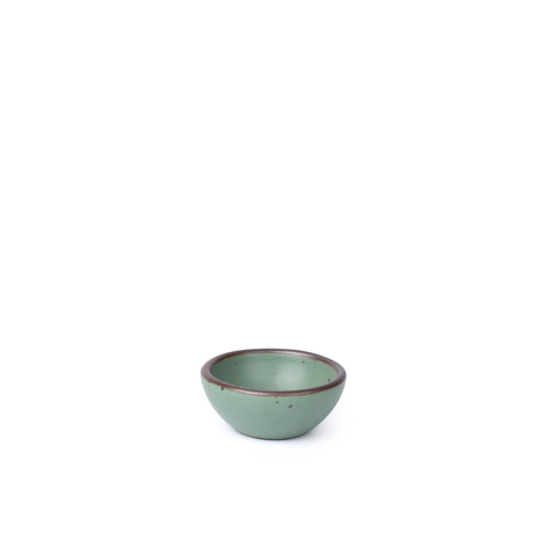 A small ceramic bowl for salt, mise en place, or jewelry in a viridian green glaze with a matte finish.