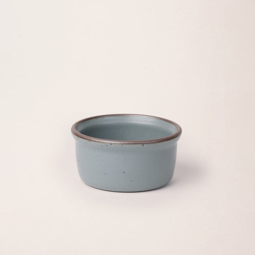 Medium ceramic ramekin in a blue-grey color with an unglazed rim