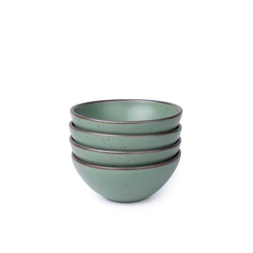 Four ceramic bowls with higher sides for soups or stews in a viridian green glaze with a matte finish.