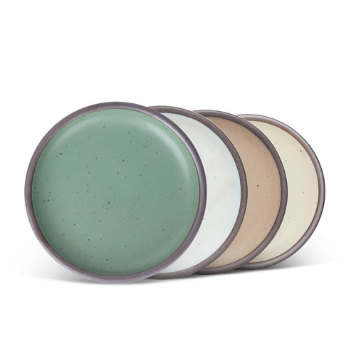 Four ceramic plates fit for lunch of small meals in a viridian green, warm brown, warm white and cool white glazes.