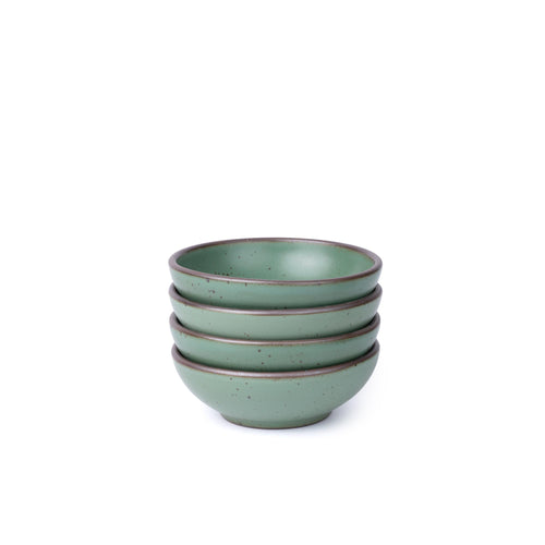 Four shallow ceramic bowls for cereal or yogurt in a viridian green glaze with a matte finish.