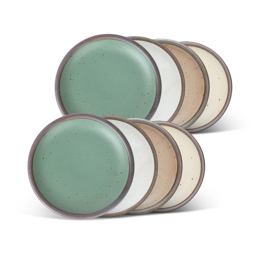 Eight ceramic plates with flat surfaces and raised edges in a viridian green, warm brown, warm white and cool white glazes.