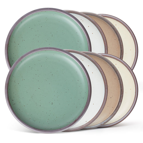Eight ceramic plates with a wide surface and low rims in a viridian green, warm brown, warm white and cool white glazes.