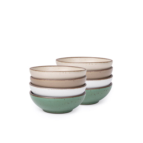 Eight shallow ceramic bowls for cereal or yogurt in a viridian green, warm brown, warm white and cool white glazes.