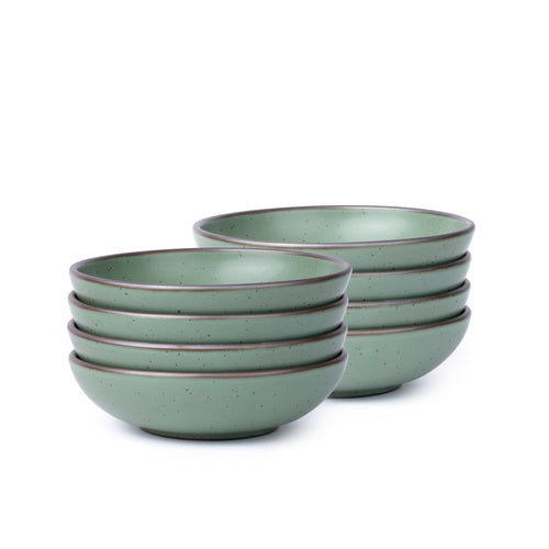 Eight shallow ceramic bowls for daily meals in a viridian green glaze with a matte finish.