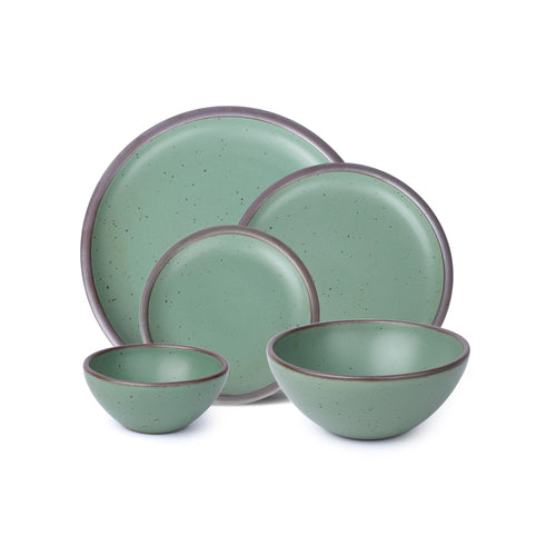A 5-piece tablesetting with plates and deep bowls in a viridian green glaze with a matte finish.