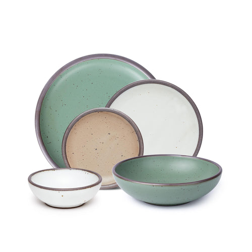 A 5-piece tablesetting with plates and shallow bowls in a viridian green, warm brown, warm white and cool white glazes.
