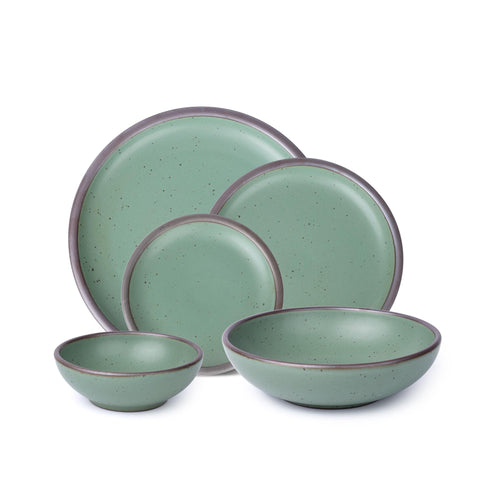 A 5-piece tablesetting with plates and shallow bowls in a viridian green glaze with a matte finish.