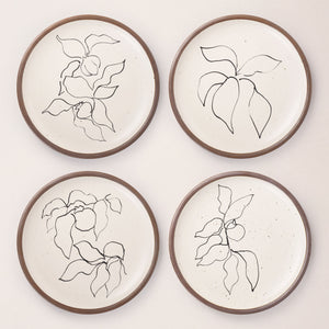 Four round ceramic dinner plates featuring Verve illustrations by Henri Matisse.