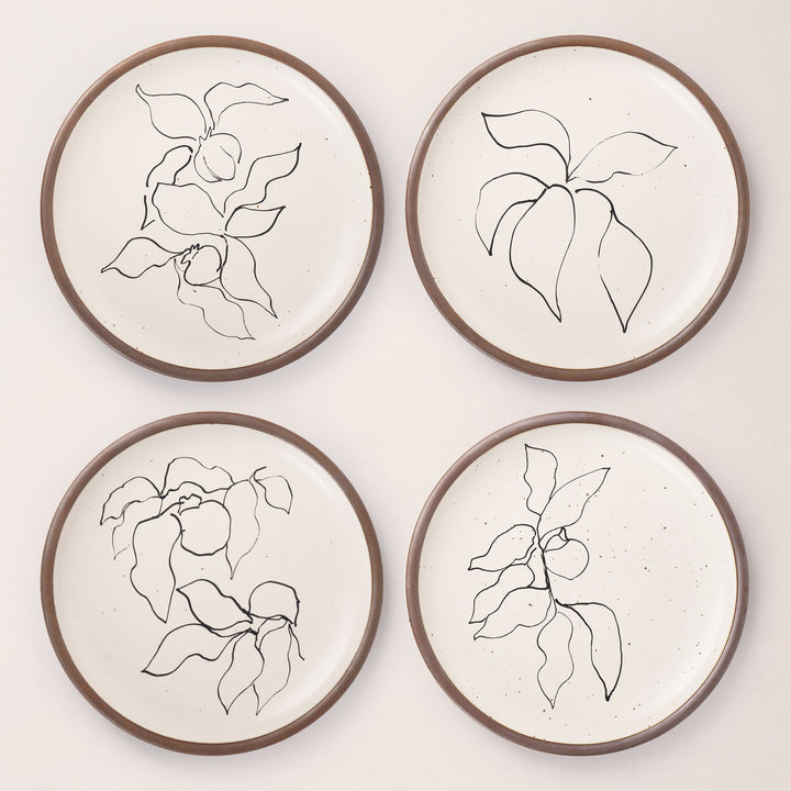 Four round ceramic dinner plates featuring Verve illustrations by Henri Matisse.