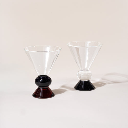 Two clear cocktail-style glasses with sculptural clear, blue and amber base.