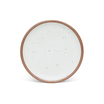 Round ceramic plate with a speckled white glaze and a natural brown rim, set against a white background.