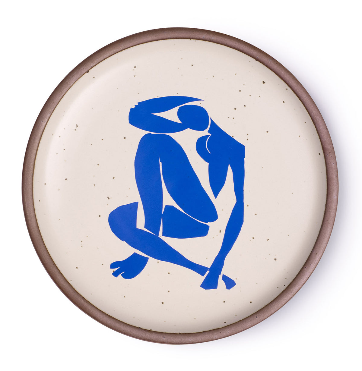 A plate featuring Nu Bleu IV, by Henri Matisse, a bright blue, abstract, silhouetted female figure in a curled, seated position, with sharp cut-out edges, centered on an off-white ceramic plate with an unglazed rim.