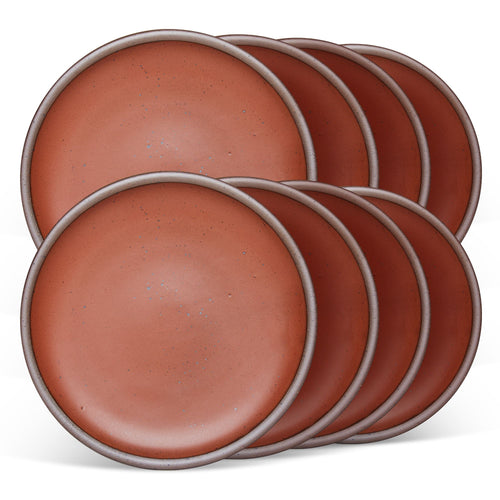 8 dinner sized ceramic plates in a cool burnt terracotta color featuring iron speckles and an unglazed rim