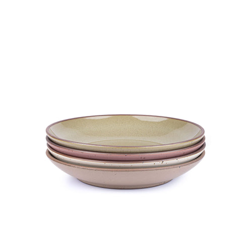 A stack of 4 large ceramic plates with a curved bowl edge in a reflective dappled grey-green, warm off-white, warm pale brown and dusty mauve pink colors featuring iron speckles and an unglazed rim.