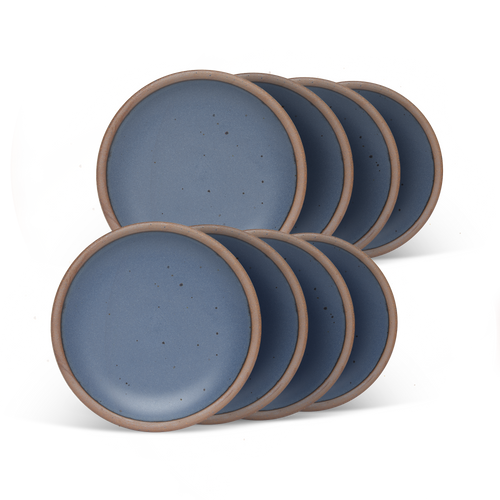 8 dessert sized ceramic plates in a cool, medium blue color featuring iron speckles and an unglazed rim.