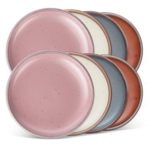 8 dinner sized ceramic plates in a cool terracotta, warm off-white, blue-grey and dusty mauve pink colors featuring iron speckles and an unglazed rim