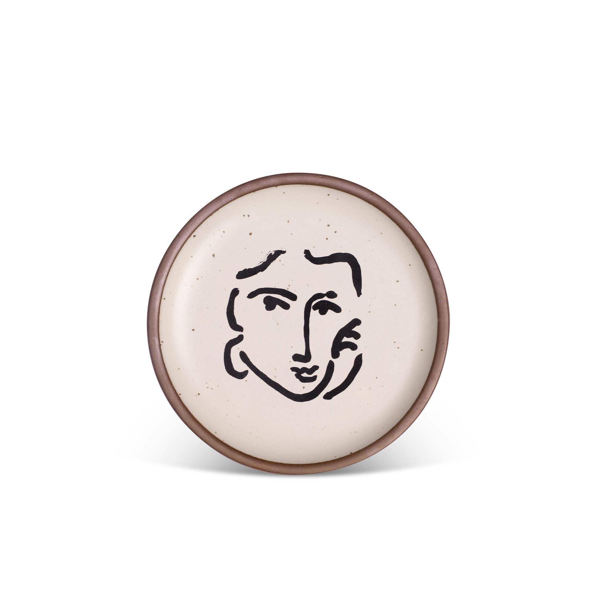 A ceramic plate featuring a decal of the artwork, Nadia au regard sérieux, by Henri Matisse. A minimalist black ink decal of a woman's face and hand resting on one cheek, in an abstract, expressive style centered on an off-white ceramic plate with an unglazed rim.