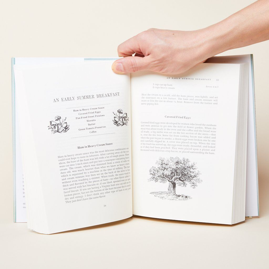 Two-page spread from the cookbook that shows a menu and contains paragraphs and drawings