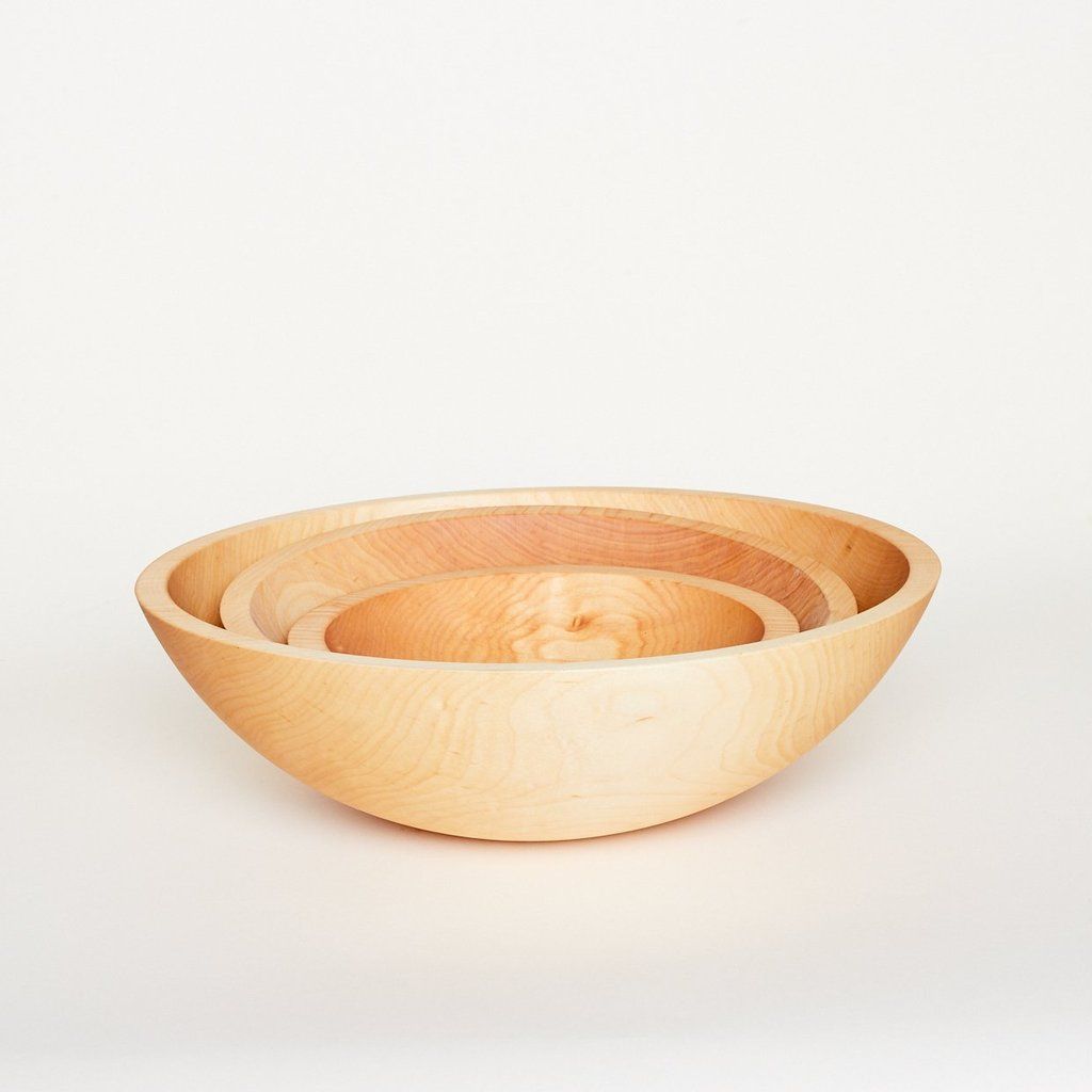 Three wooden bowls of different sizes in a stack